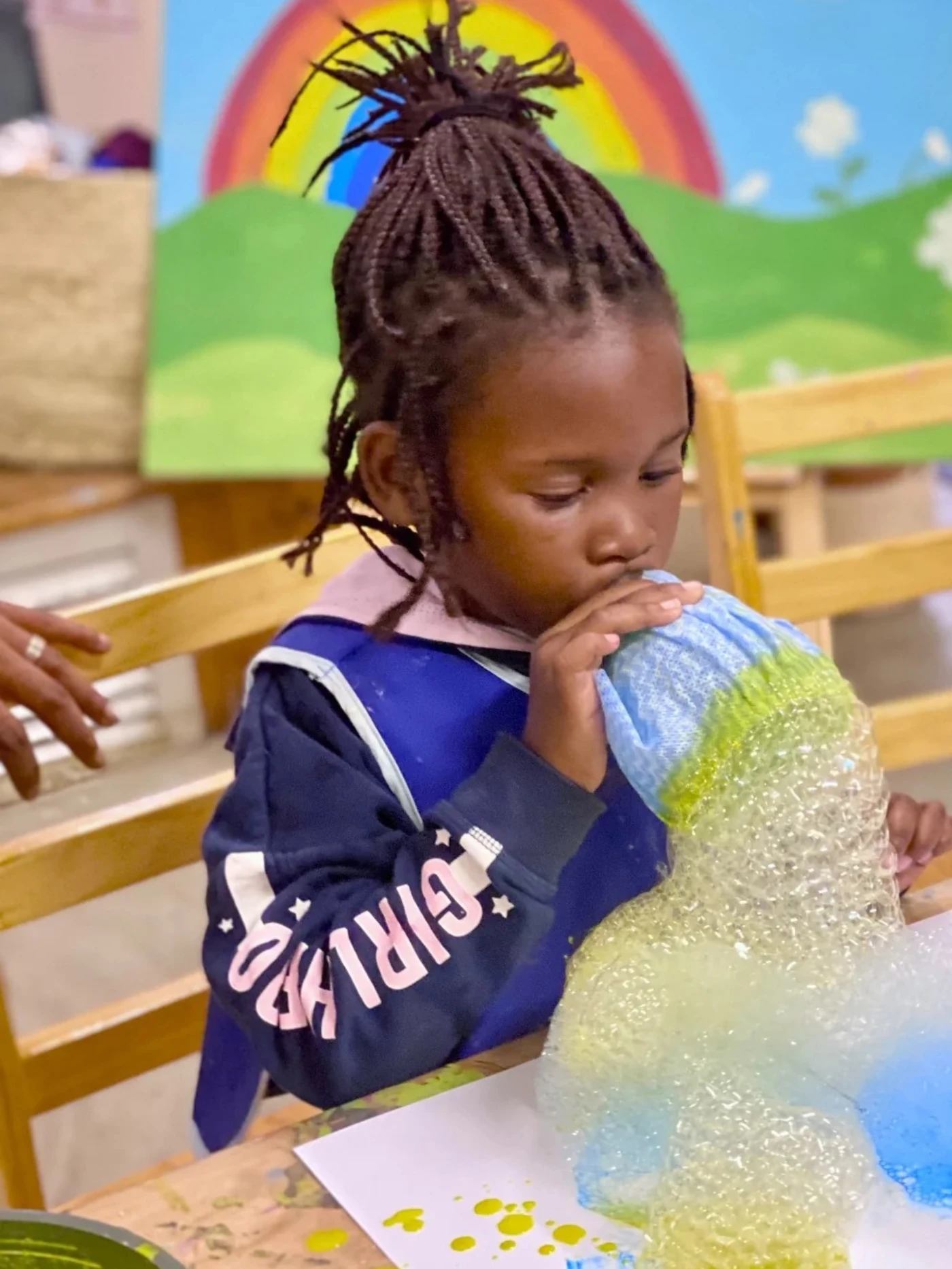 Young girl engaged in a creative classroom activity